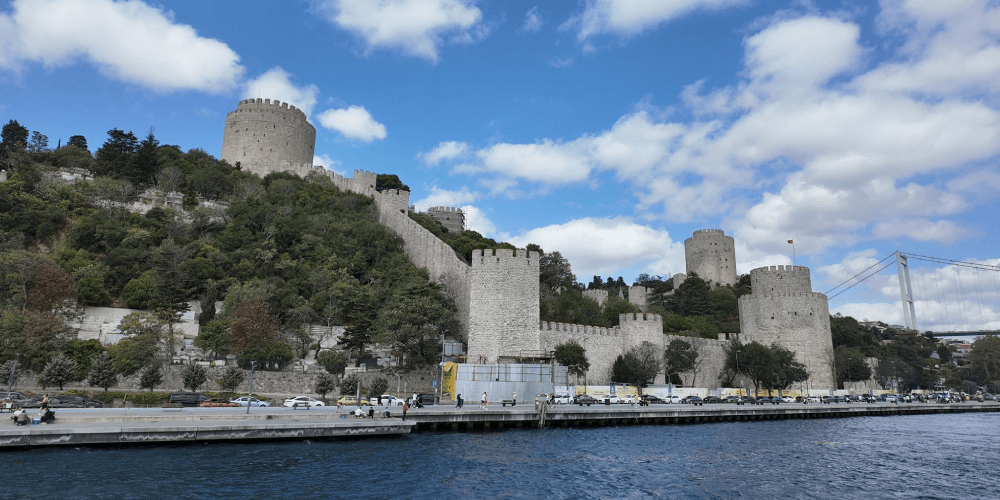 Bosphorus lunch cruise boat sailing between Europe and Asia in Istanbul