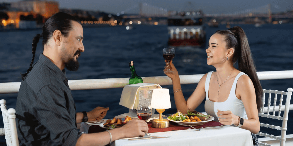 Guests enjoying all-inclusive Turkish dinner on luxury Bosphorus New Year cruise