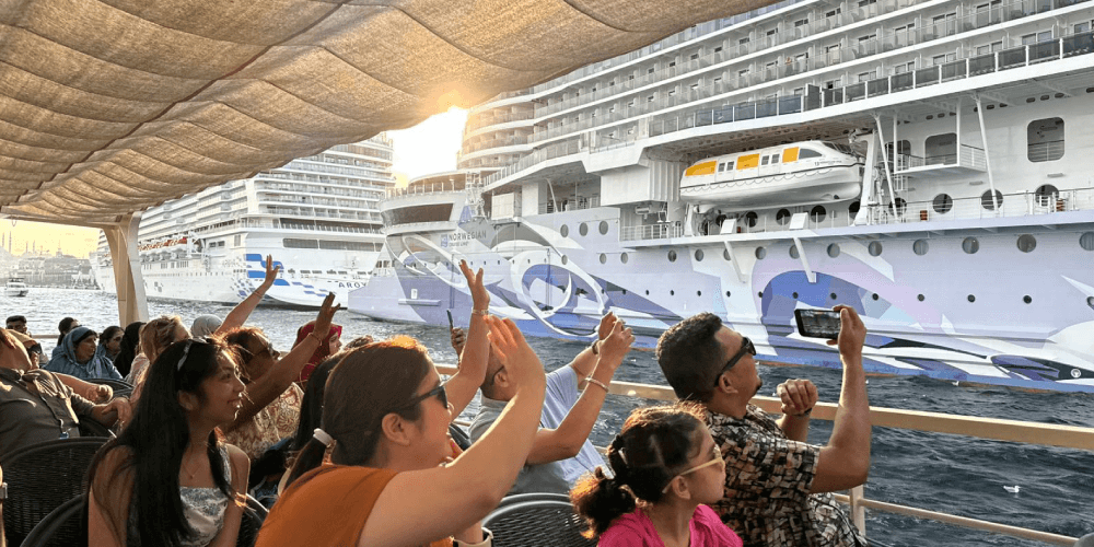 Passengers enjoying peaceful sunset cruise along the Bosphorus in Istanbul